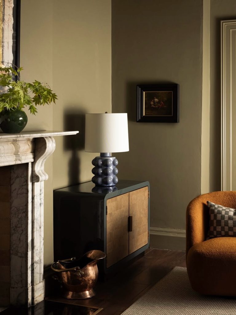 olive green wall with cherry wood floor